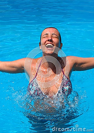 Girl jumping from pool