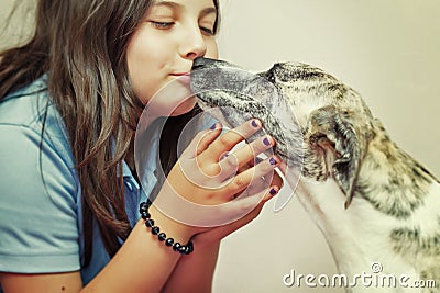 Girl kissing dog