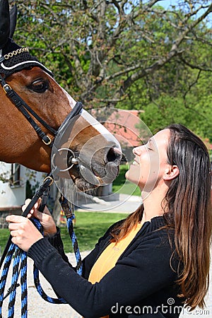 Girl kissing horse