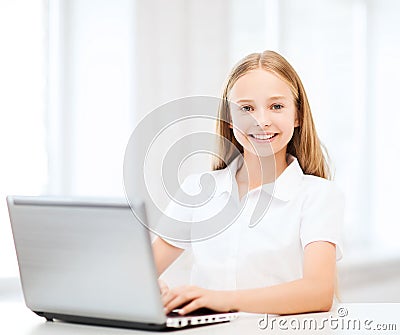 Girl with laptop pc at school