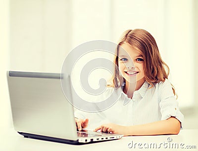 Girl with laptop pc at school