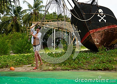 Girl launching pirates boat, adventure.