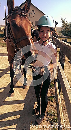 Girl leading her horse