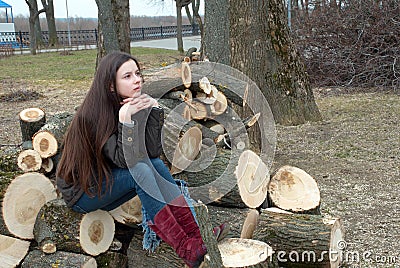 Girl with long hair on logs