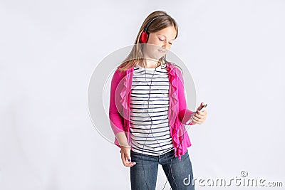 Girl looking at cell phone with headphones