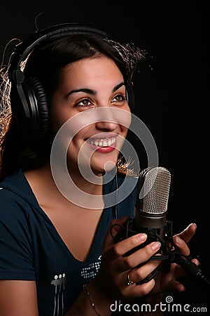 Girl with a microphone and head-phones