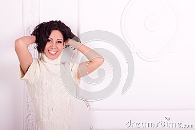 Girl near a white wall
