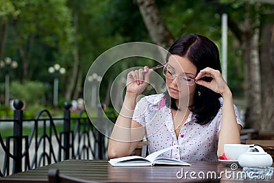 Girl with notepad in cafe