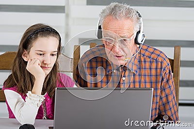 Girl and old man on laptop