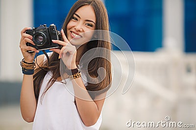 Girl photographer with professional SLR camera