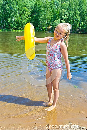 Girl playing with a rubber ring