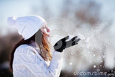 Girl playing with snow