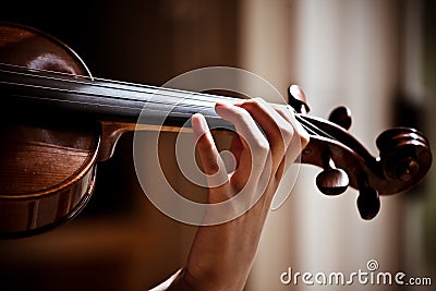 Girl playing violin, holding fingerboard