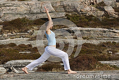 Girl in power yoga warrior one position