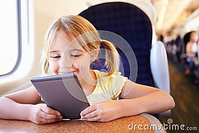 Girl Reading A Book On Train
