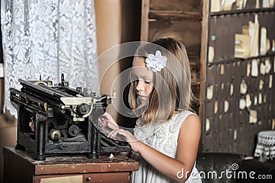 Girl with a retro typewriter