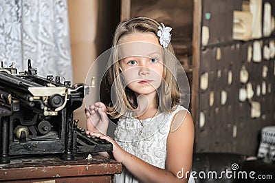 Girl with a retro typewriter