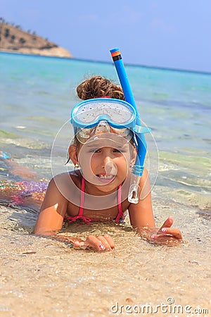 Girl in the sea with diving mask