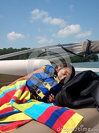 Girl sleeping in life jacket