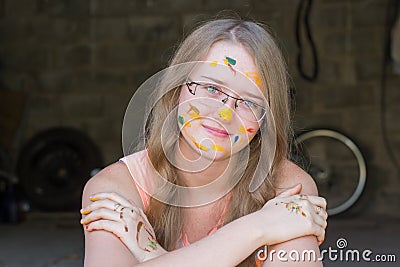 Girl smeared in paint