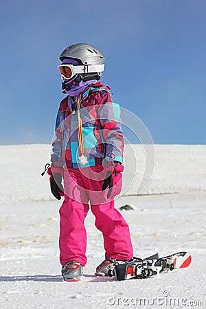 Girl on the snow with medal