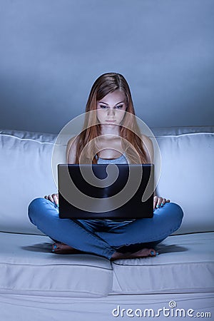 Girl spending night with computer