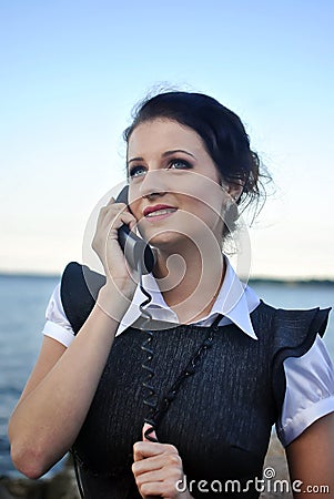 Girl with a telephone receiver in hand