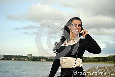 Girl with a telephone receiver in hand