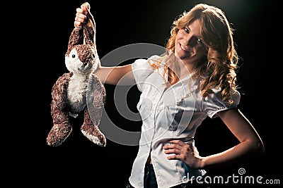 Girl with a toy rabbit