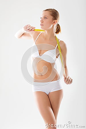 Girl underwear engaged in measurement figures