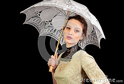 Girl in Victorian dress holding a white umbrella