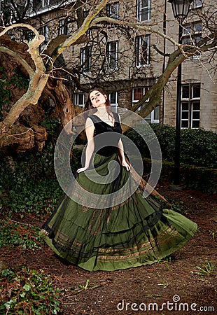 Girl in Victorian dress in the park