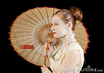 Girl in Victorian dress in profile with Chinese umbrella