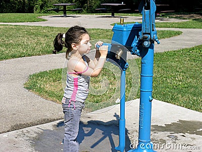 Girl at water fountain