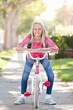 Girl Wearing Rucksack Cycling To School