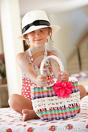 Girl Wearing Swimming Costume And Straw Hat