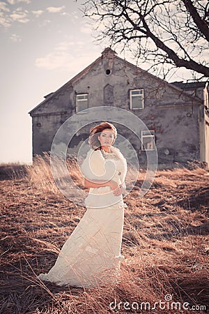 Girl in white dress. Bride in the park. Photo in vintage style. Mystery.