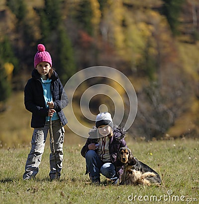 Girls hiking with dog