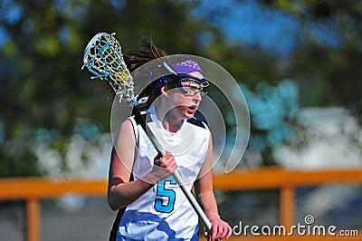 Girls Lacrosse player with the ball