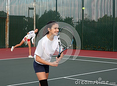 Girls playing tennis