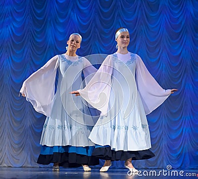Girls in white dresses dancing on stage, Russian National Dance