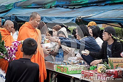Giving food to monk