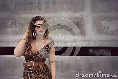 Glamorous woman in animal print outfit maxi dress