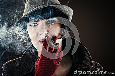 Glamorous woman in retro style with cigar