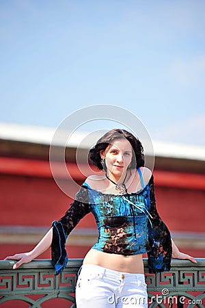 Glamorous young woman in blue blouse