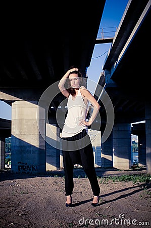 Glamour model near bridge