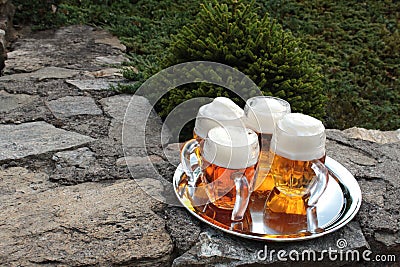 Glass of beer on a stone wall