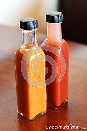 Glass bottles of chilli sauce