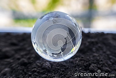 Glass globe on the ground