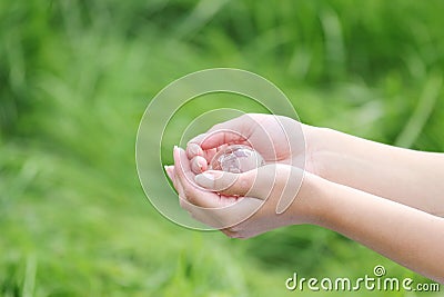 Glass globe in hand